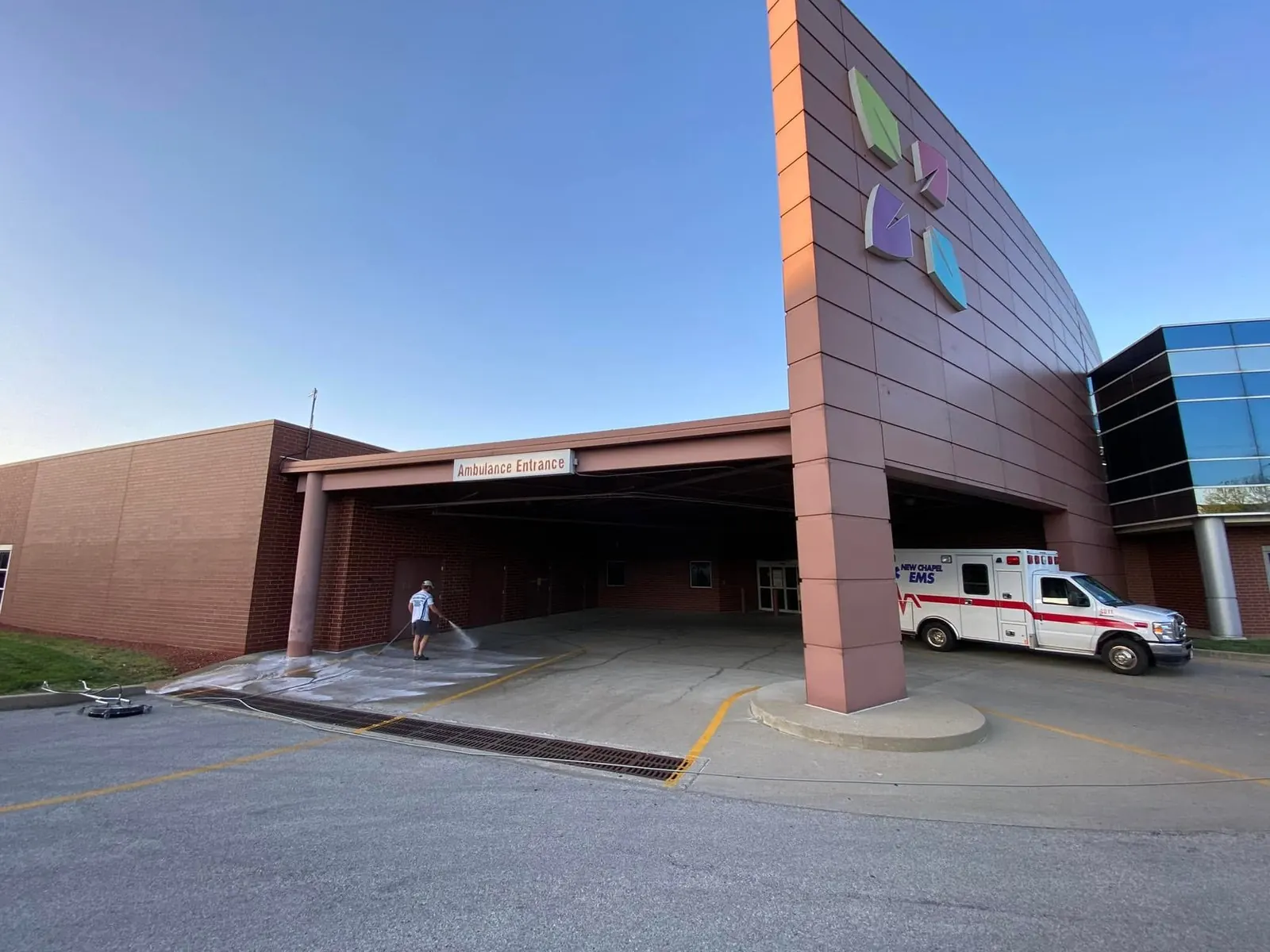Washing the covered ambulance bay of a hospital entrance