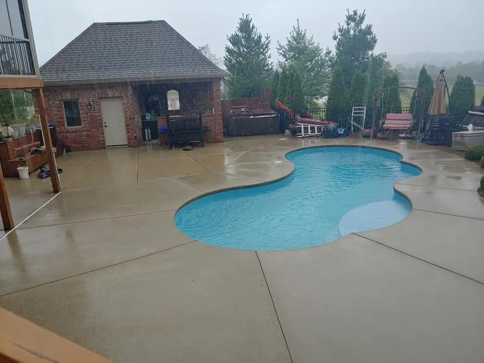 The same concrete pool deck, clean and even, after cleaning