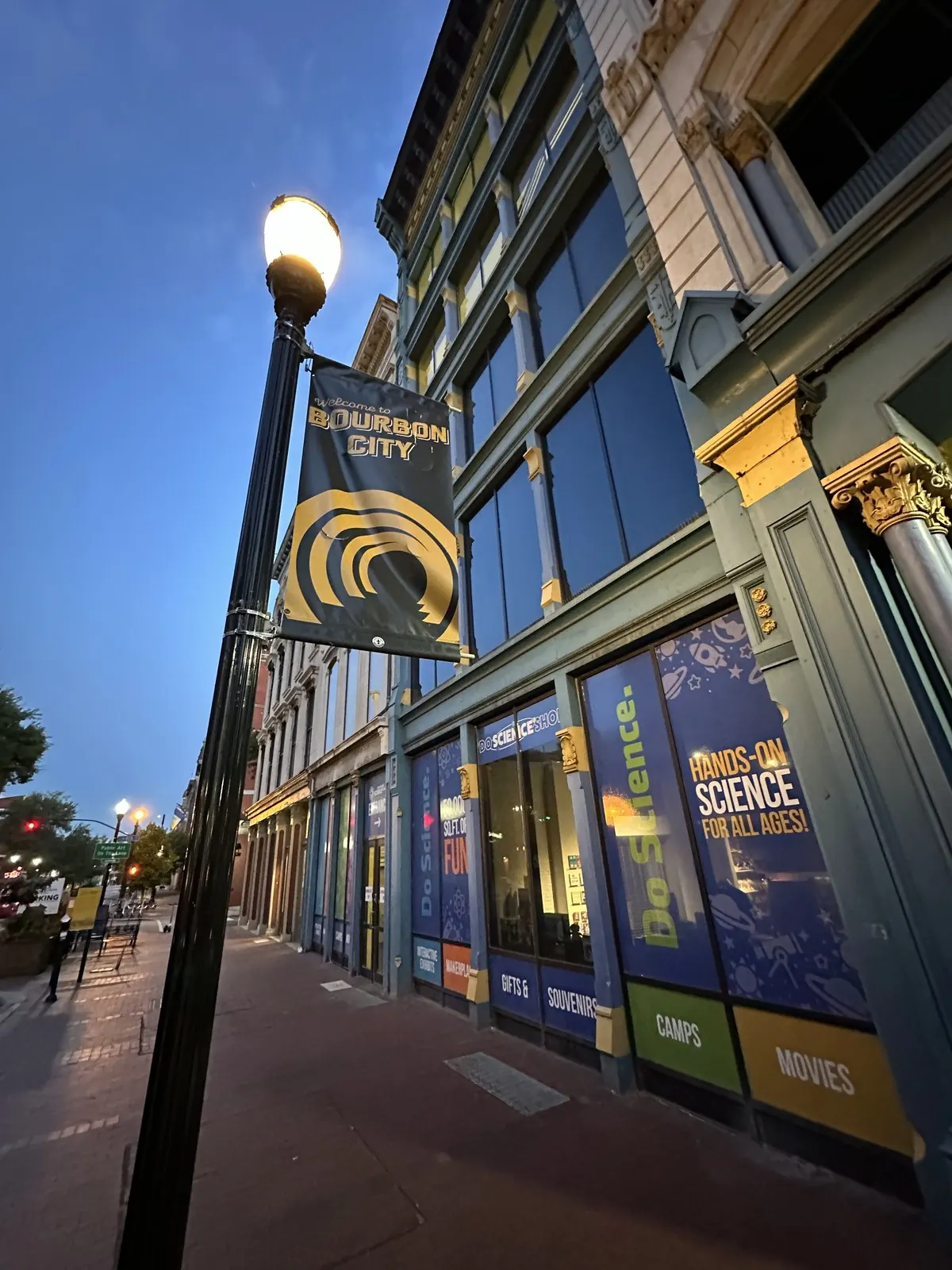 Historic building facade with banners at dusk