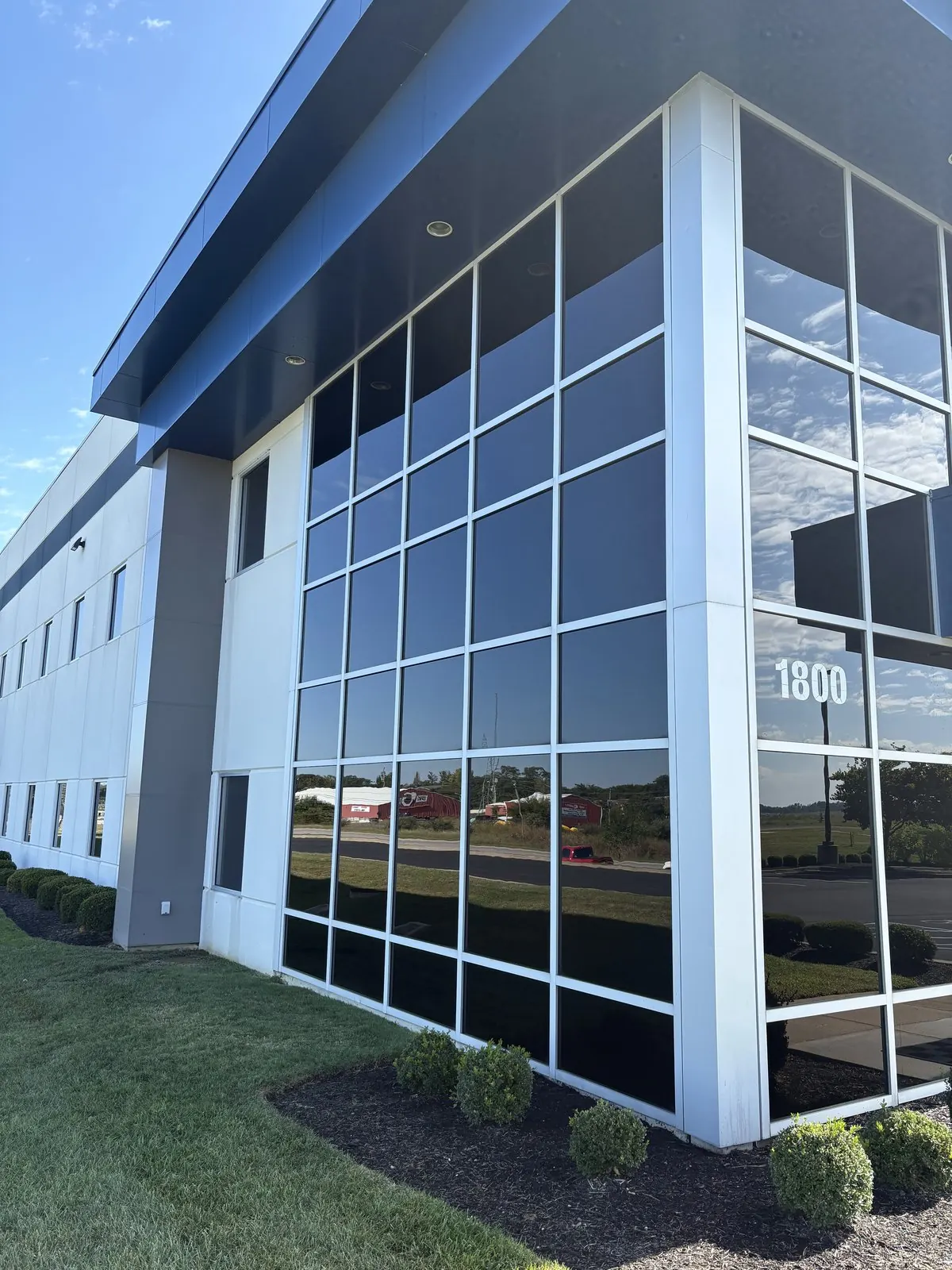Corner of a modern office building with floor-to-ceiling windows